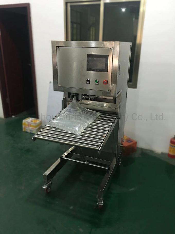 箱の詰物および機械胸当ての注入口をカバーすることの半自動ワイン袋
